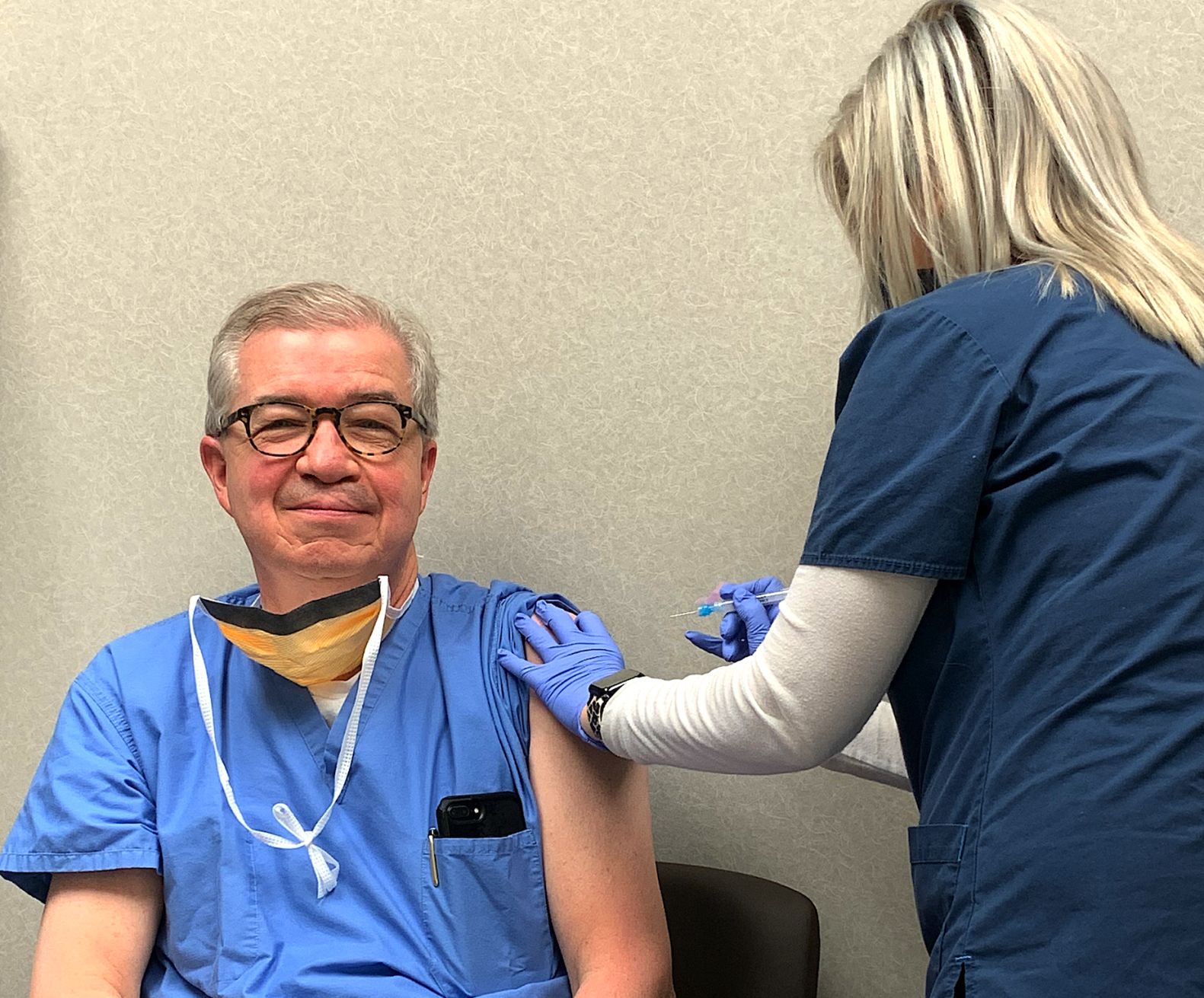 Hospital staff begins receiving vaccine